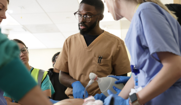 Doctors working on a patient.