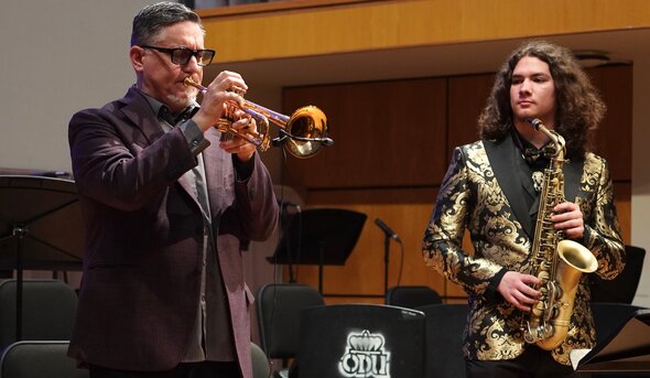 Jazz studies major and saxophone player Jayce Whiddon, right, looks on as visiting artist Rex Richardson plays trumpet solo during his 2026 residency at Old Dominion University. 