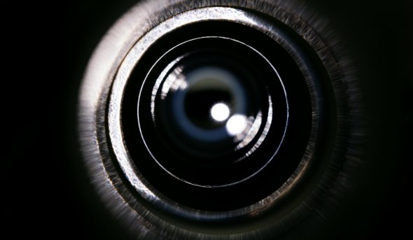 Light reflects off niobium inside a superconducting radiofrequency cavity at Jefferson Lab.