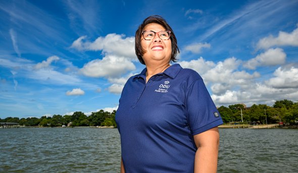 Wei Yusuf in front of water