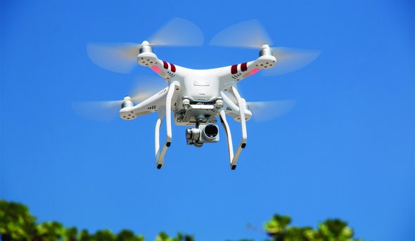 drone-flying-against-blue-sky