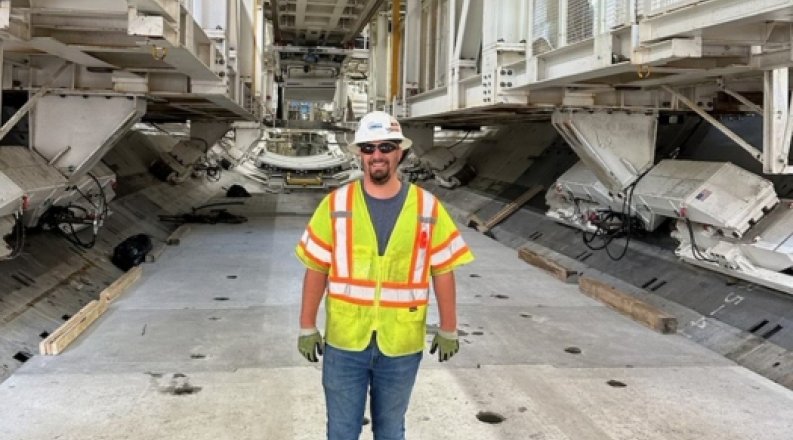 engineering major stands in front of HRBT project