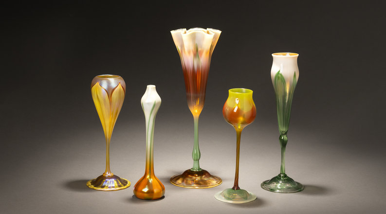 Glass artwork lined up in a row. 