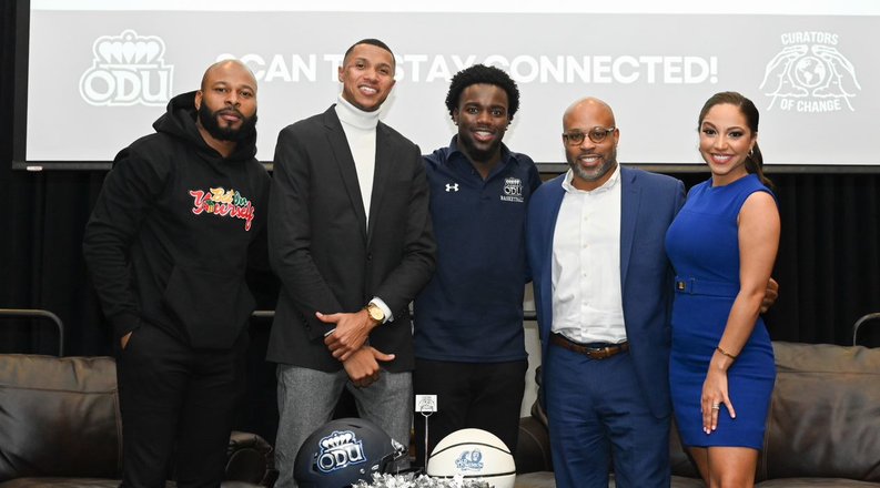 Group stands on stage