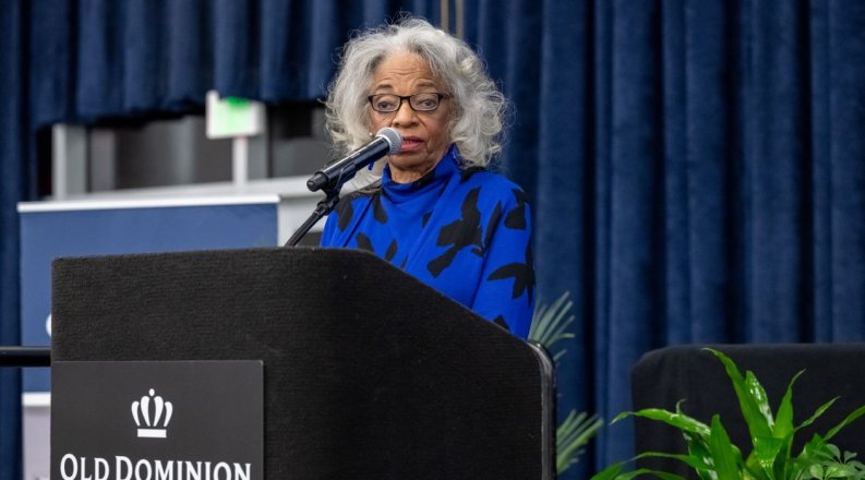 Woman speaking at podium