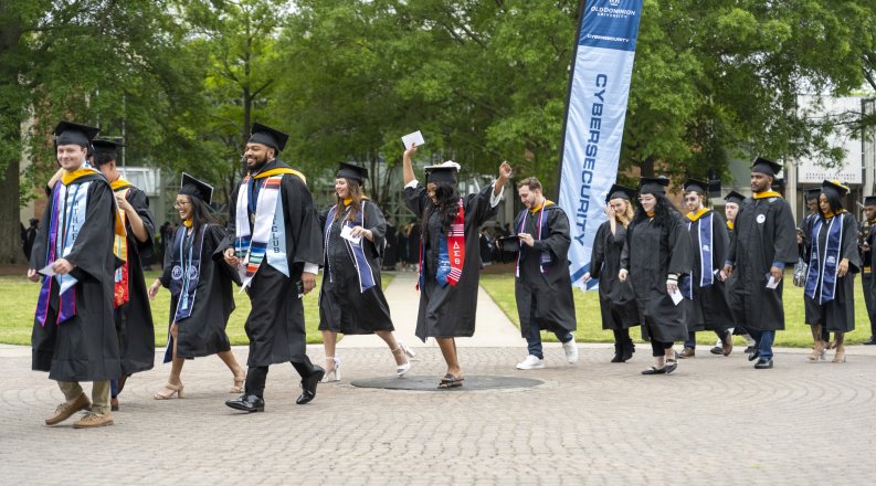 Graduates cross the ODU seal in 2024.