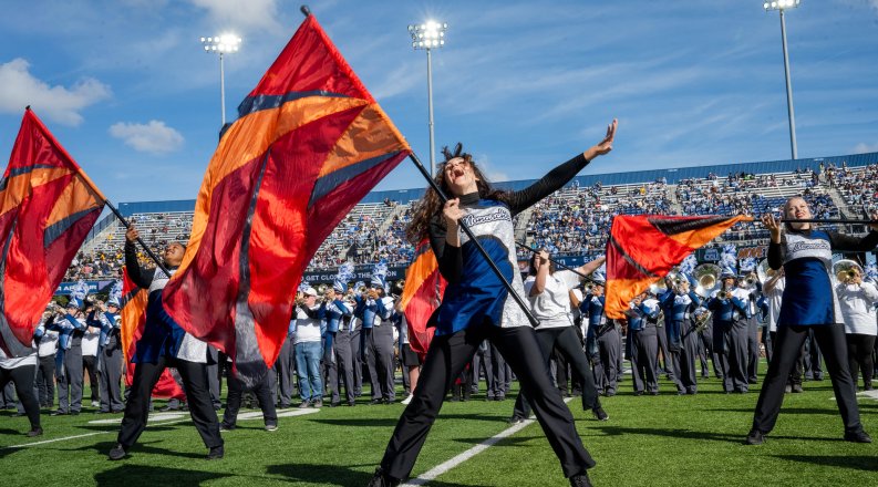 ODU's color guard performs on the football field.