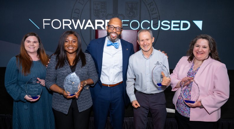 ODU President Brian O. Hemphill poses with the four Monarch Pillar Award winners