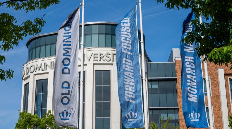Banners outside Old Dominion University building reading "forward-focused" and "Monarch Nation" and "Old Dominion University"