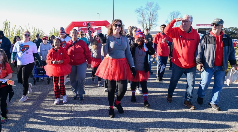 People walking across a finish line