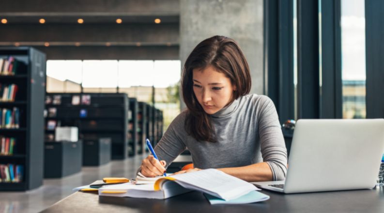 student studying in library