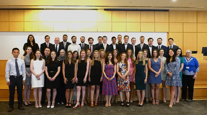 group of students posing on stage