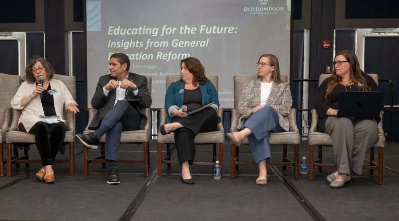 Group of people on stage for a panel