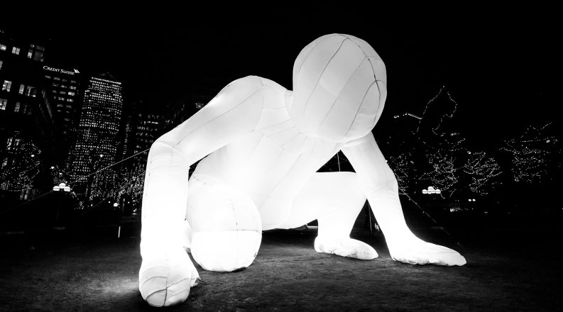 Photo of a giant inflatable human. 