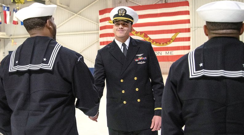 Juan Brambila shakes hands with someone.