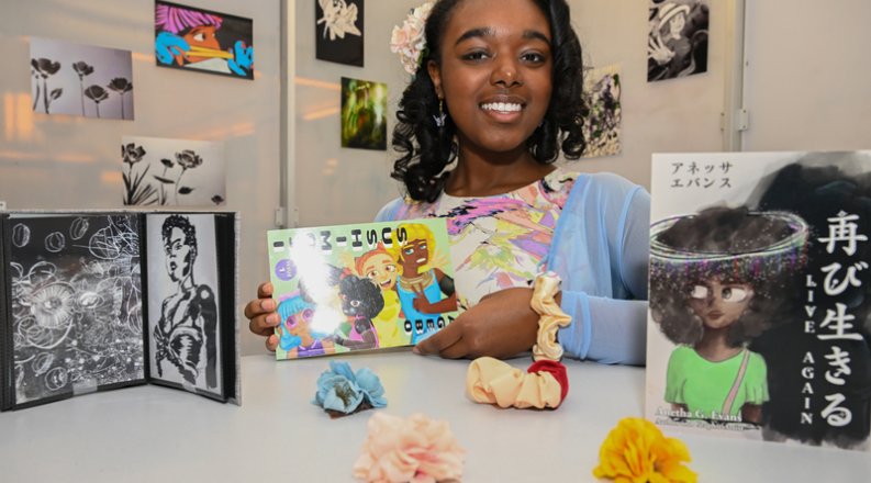 A girl sitting at a table with blocks