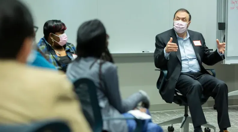 Dr. Abuhamad talking with a group