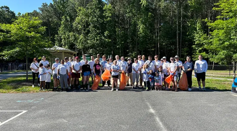 group of volunteers in a parking lot