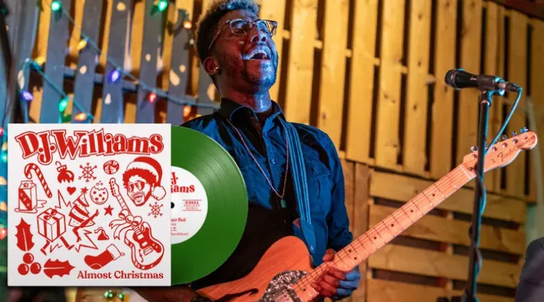 Musician DJ Williams playing a guitar