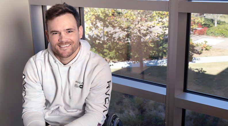 Davis Takhvar seated in a window