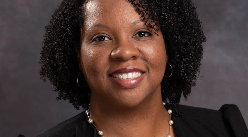 Photo of a woman smiling. 