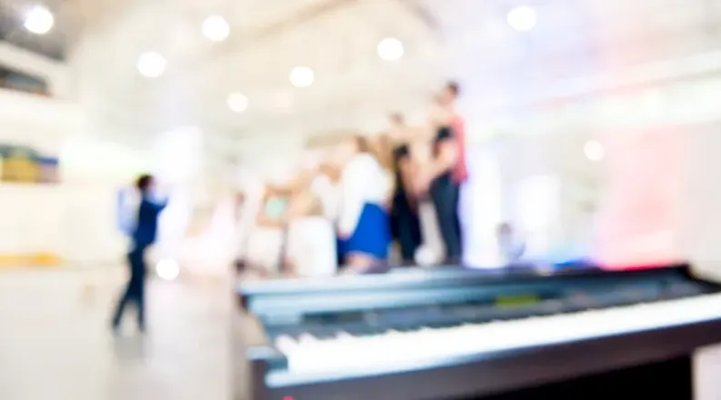 Community choir with keyboard in foreground