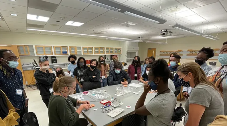 students learn suturing