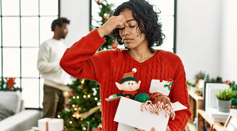 woman looking at christmas tree