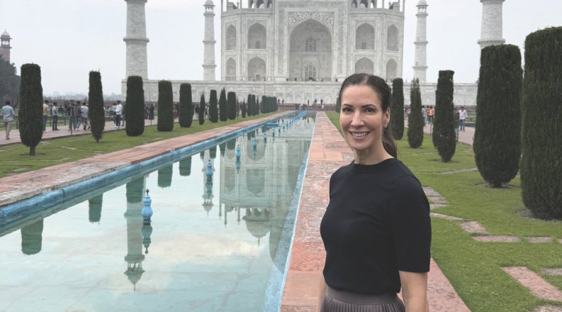 Helen Crompton, Ph.D., stands outside the Taj Mahal in India 