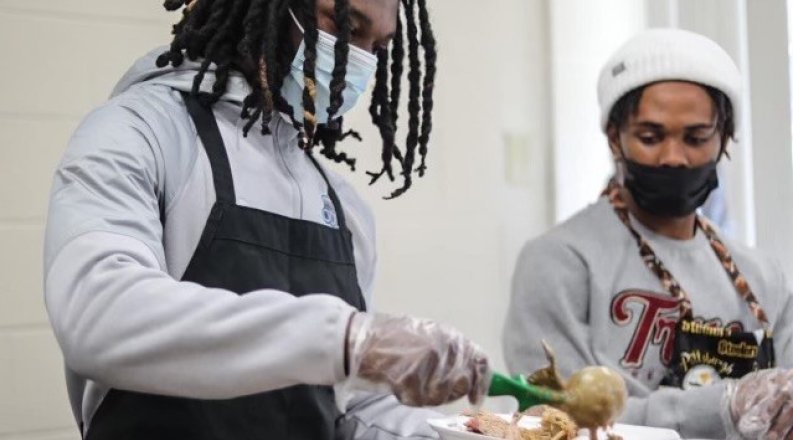 Student serving food