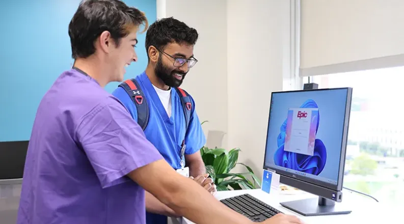 students looking at a computer