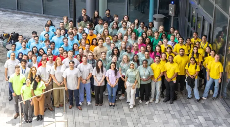 group of students on sidewalk looking towards camera