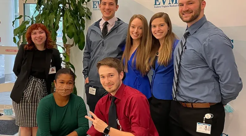 students posing for a photo on campus