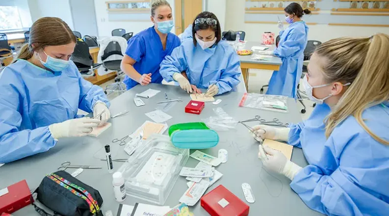 surgical assisting students practice suture skills