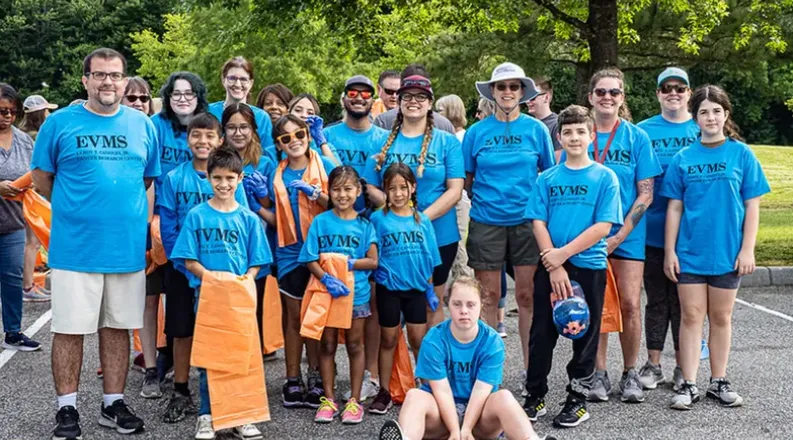 group of volunteers at service event outdoors.