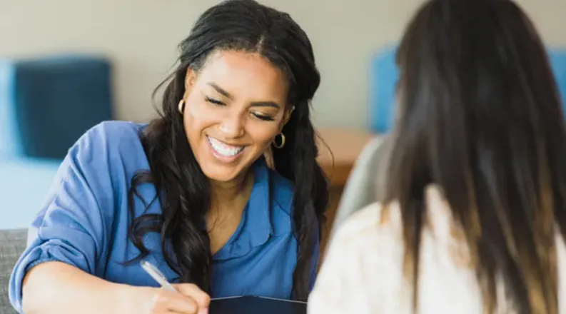 Female smiling during an interview