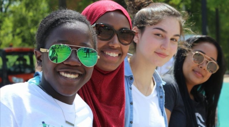 four women look at camera
