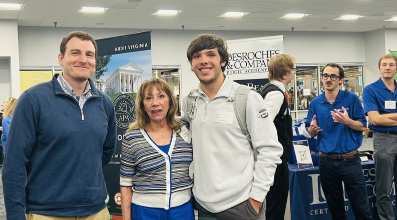 student and business at career fair