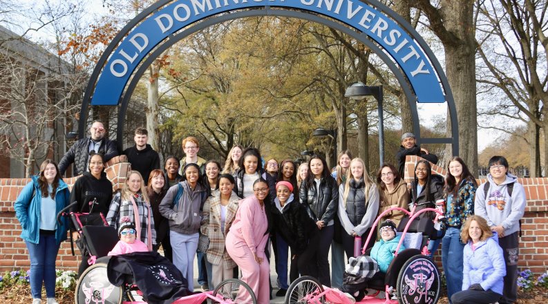 people in front of an ODU sign