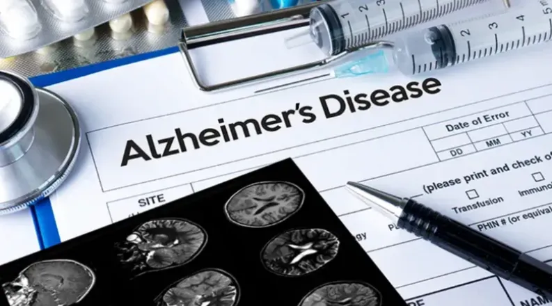 Alzheimer's form with brain scans and medication laying on t