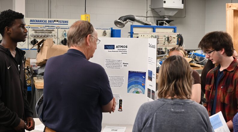 ATMOS team presenting their research.
