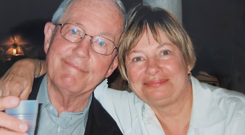 Photo of a man and woman smiling.