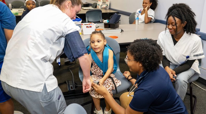 Child being serviced at health clinic