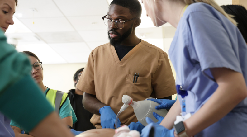 Doctors working on a patient.