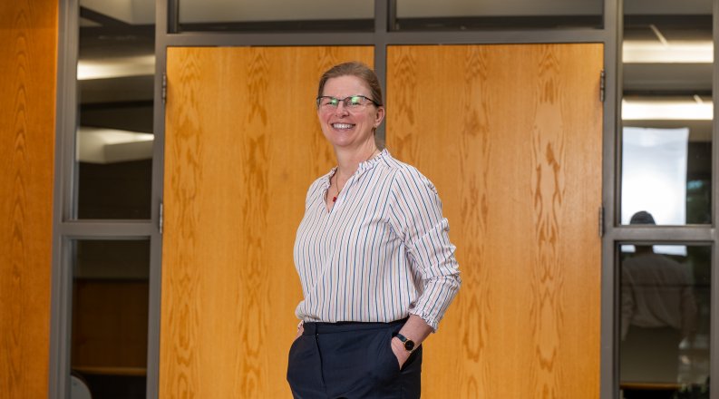 Erika Marsillac standing in front of Strome College of Business.
