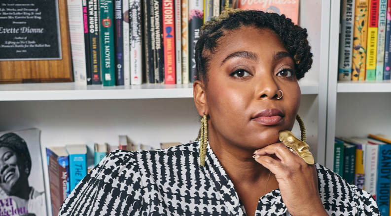 A woman poses for a photo.