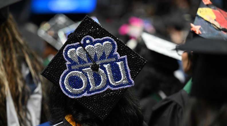 A photo of a graduation cap that reads "ODU."