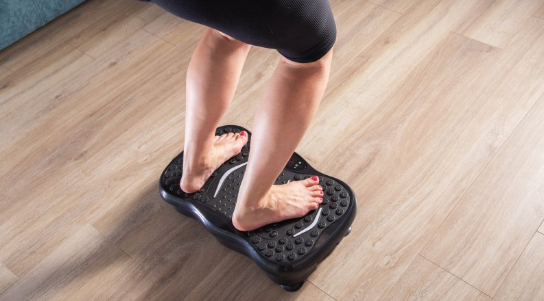 feet on a beveled balance board. 