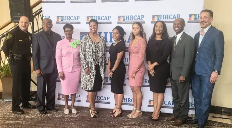 Ethlyn McQueen-Gibson stands with other recipients of the Co