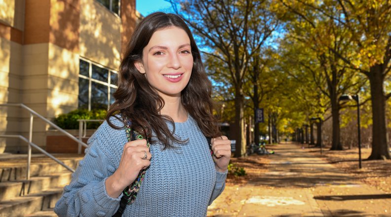 A woman stands on ODU’s campus.